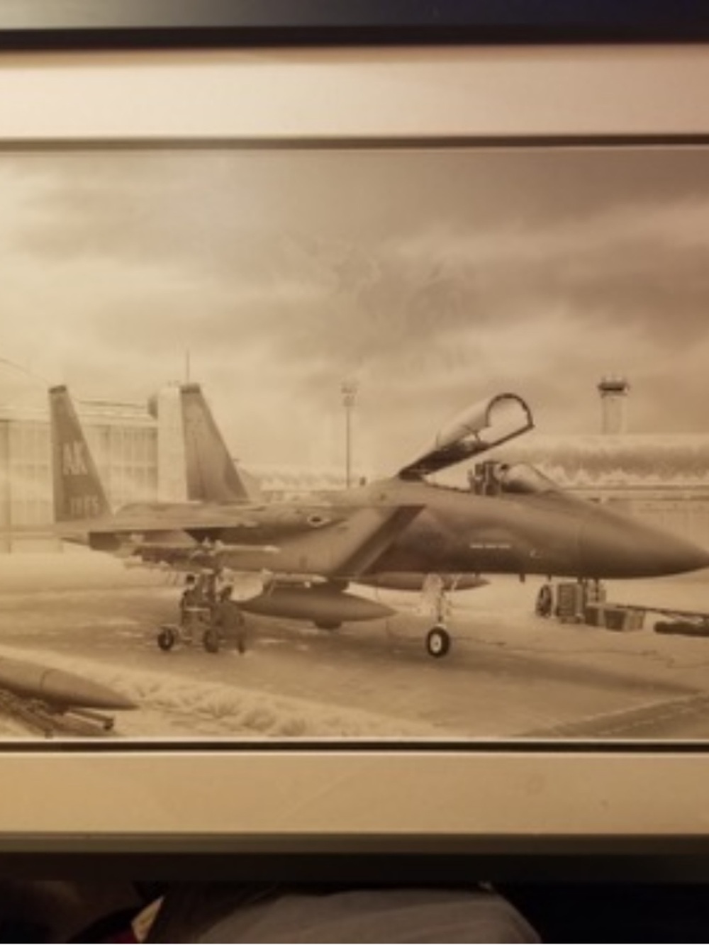A framed picture by James Morris of off at Air Force base strategic air command